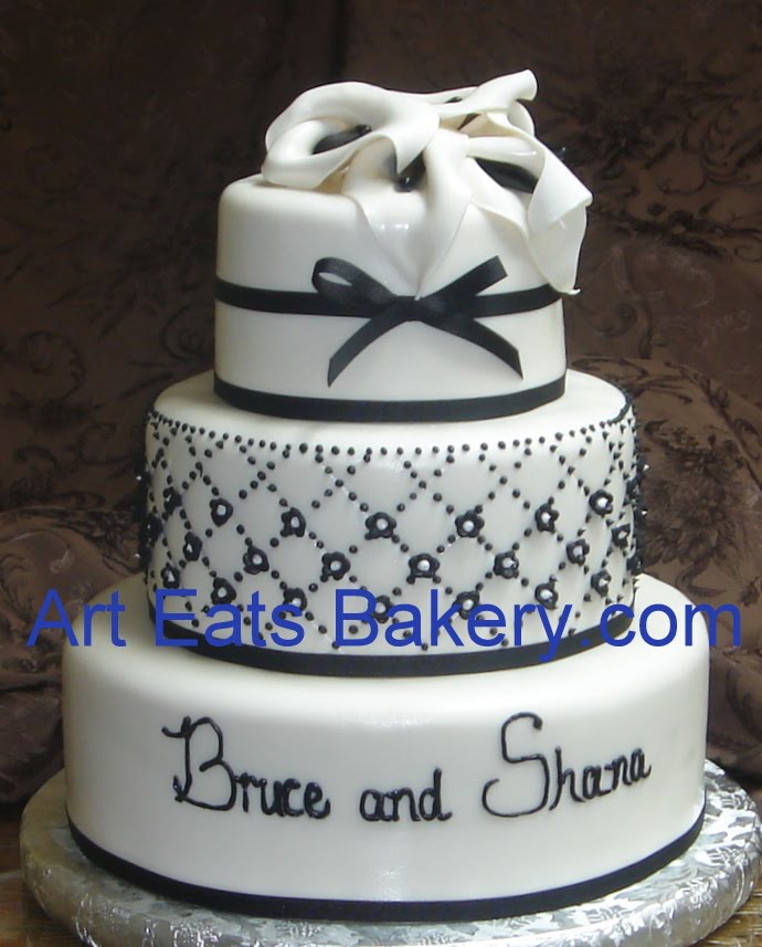 Three tier black and white custom fondant wedding cake