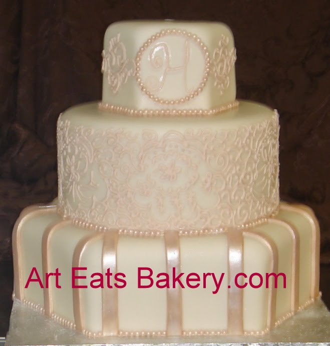 Ivory fondant round and hexagon unique elegant wedding cake with royal icing