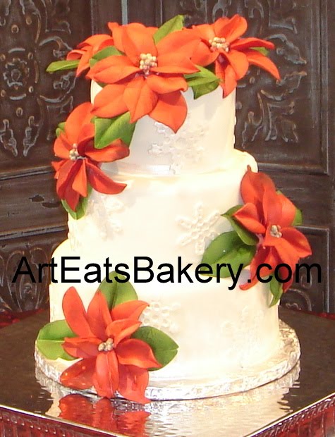 Three tier white fondant wedding cake with pearl snowflakes and red sugar